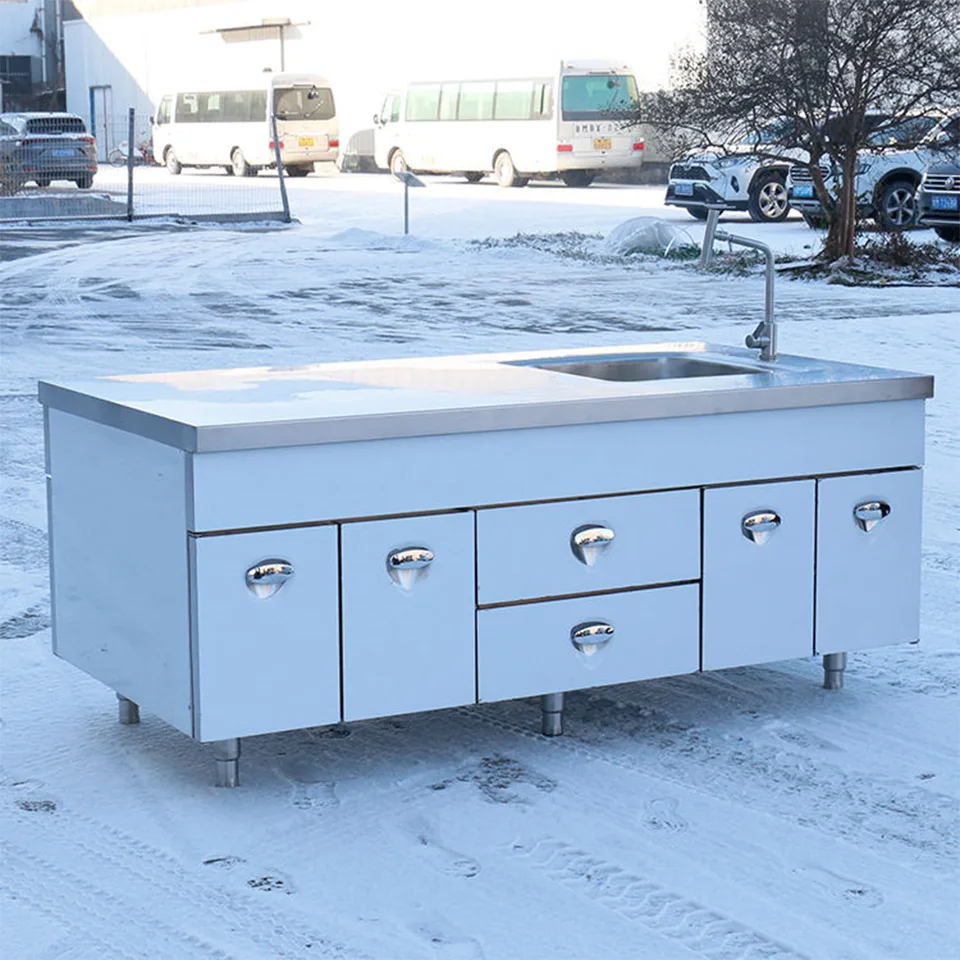Mesa de trabajo de acero inoxidable con fregadero, armarios y cajones para cocinas comerciales