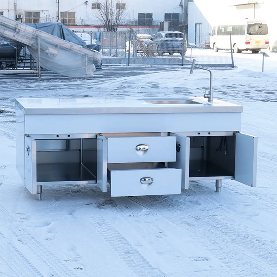 Mesa de trabajo de acero inoxidable con fregadero, armarios y cajones para cocinas comerciales